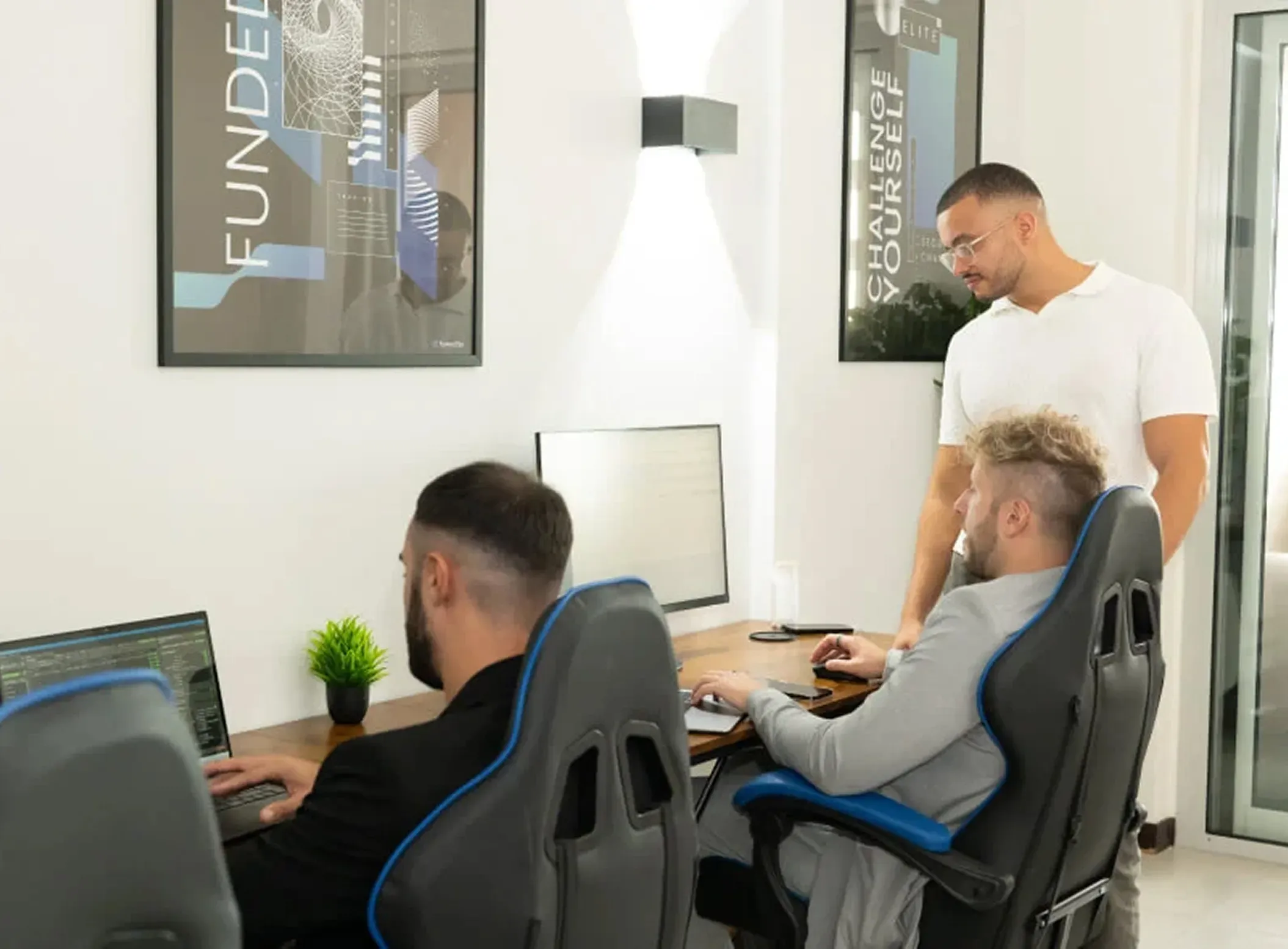 FuturesElite team members working at their desks